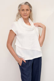 Model wears Hazel Linen Top Warm White with soft fall cowl neck