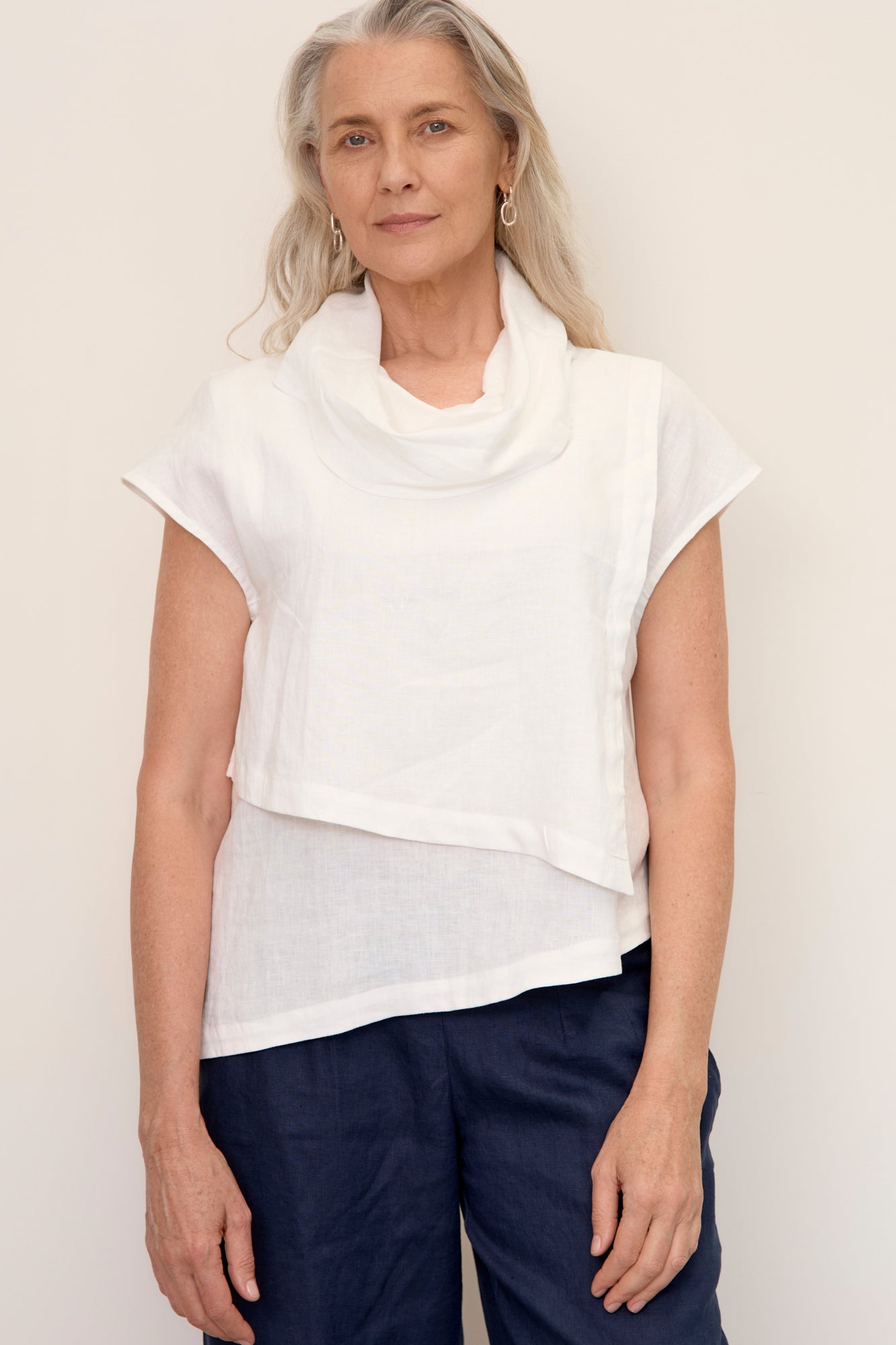 Model wears Hazel Linen Top Warm White with soft fall cowl neck