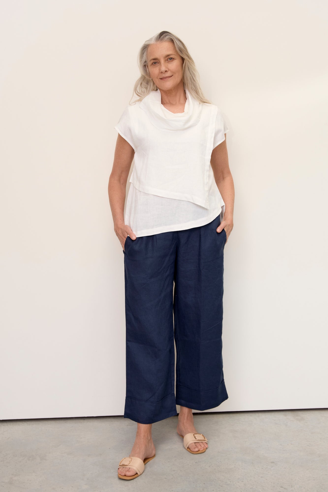 Model wears Hazel Linen Top Warm White with soft fall cowl neck