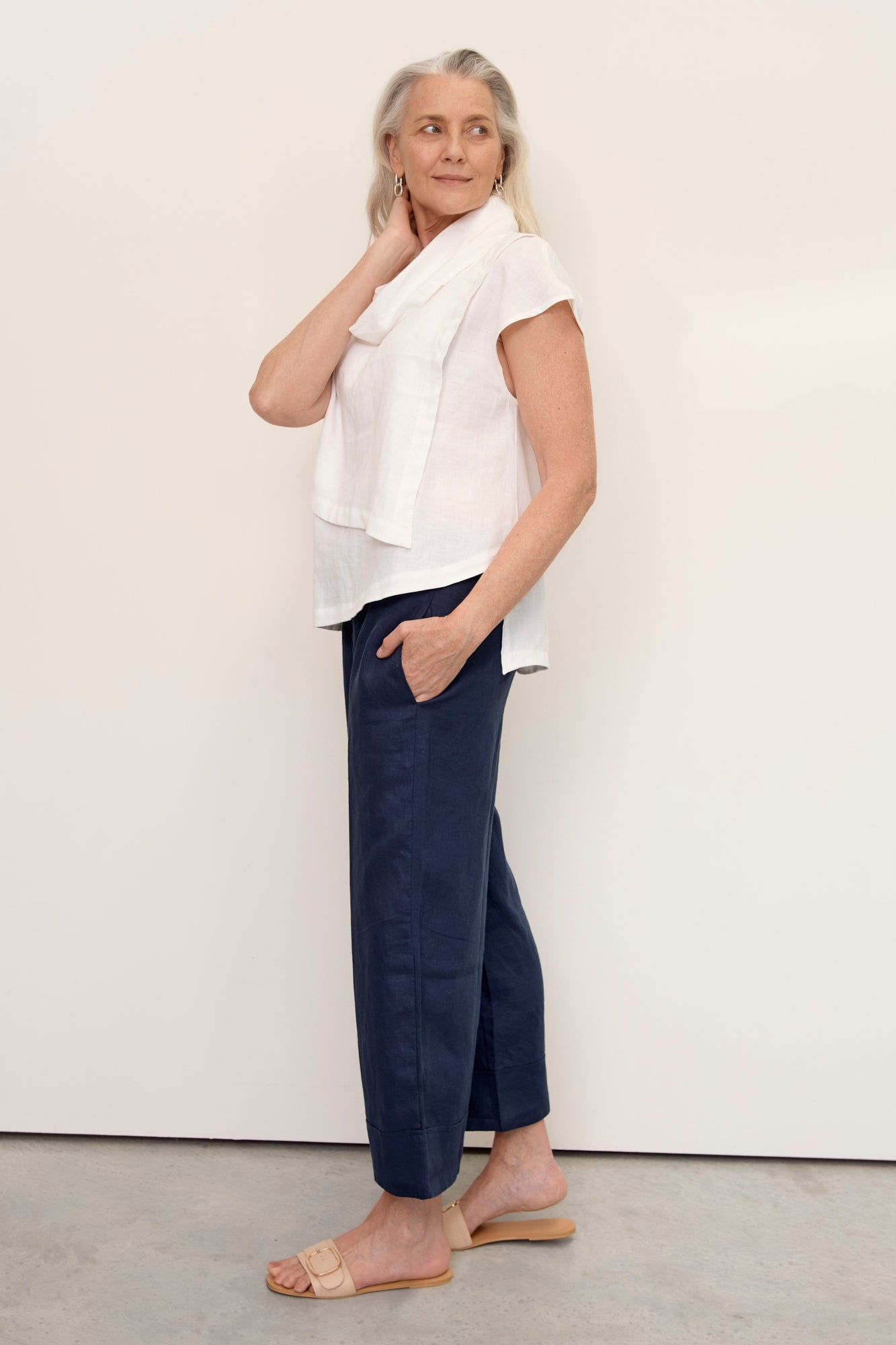 Model wears Hazel Linen Top Warm White with soft fall cowl neck
