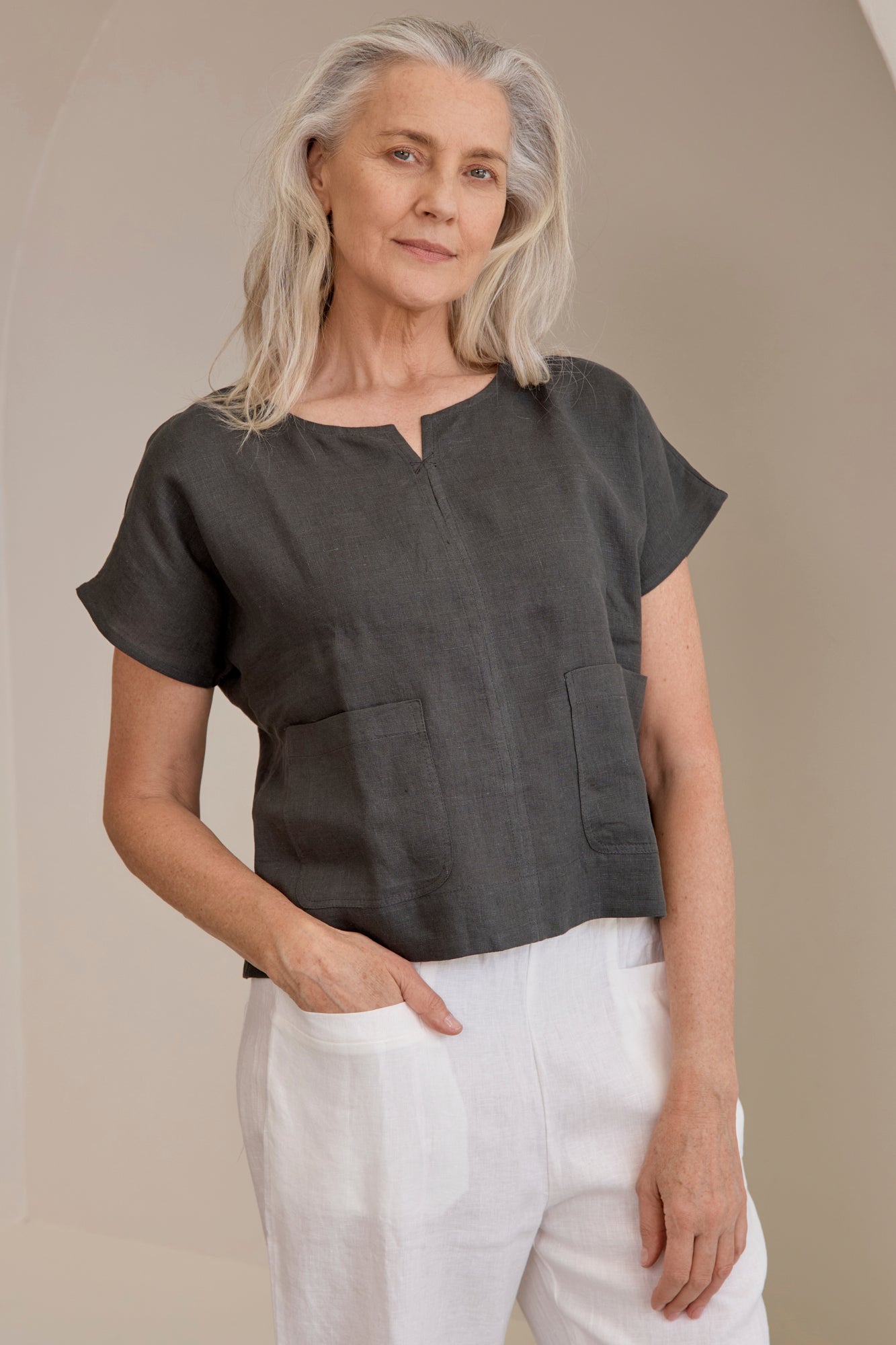 Model wears Zoe Linen Top Charcoal a considered slightly cropped design