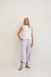 Model wears Palermo Linen Pants Silver with ankle detail