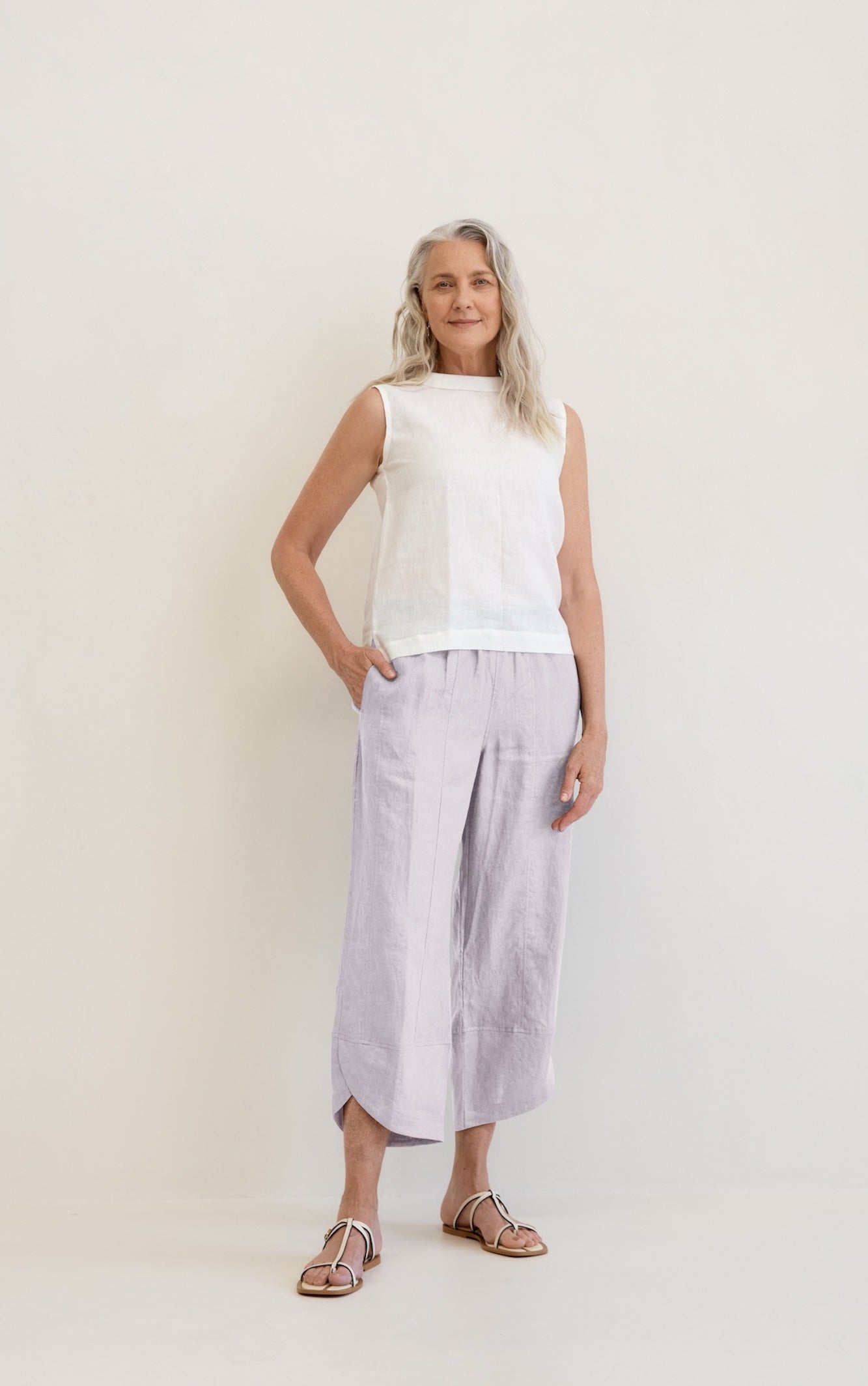 Model wears Palermo Linen Pants Silver with ankle detail