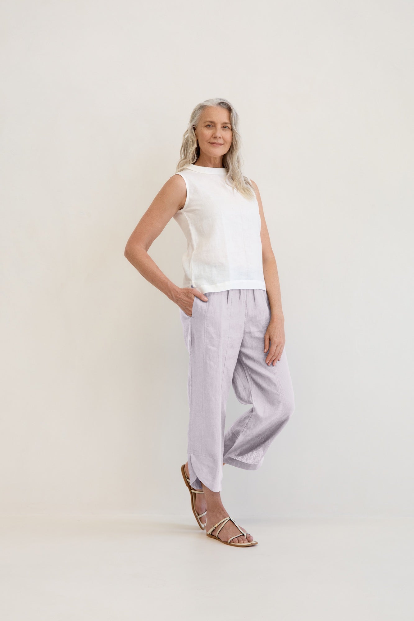 Model wears Palermo Linen Pants Silver with ankle detail