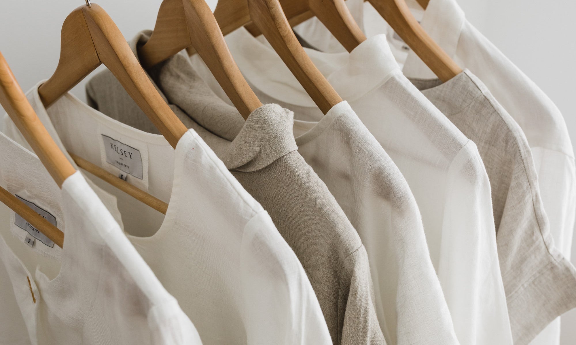 Linen shirts hanging on timber coat hangers