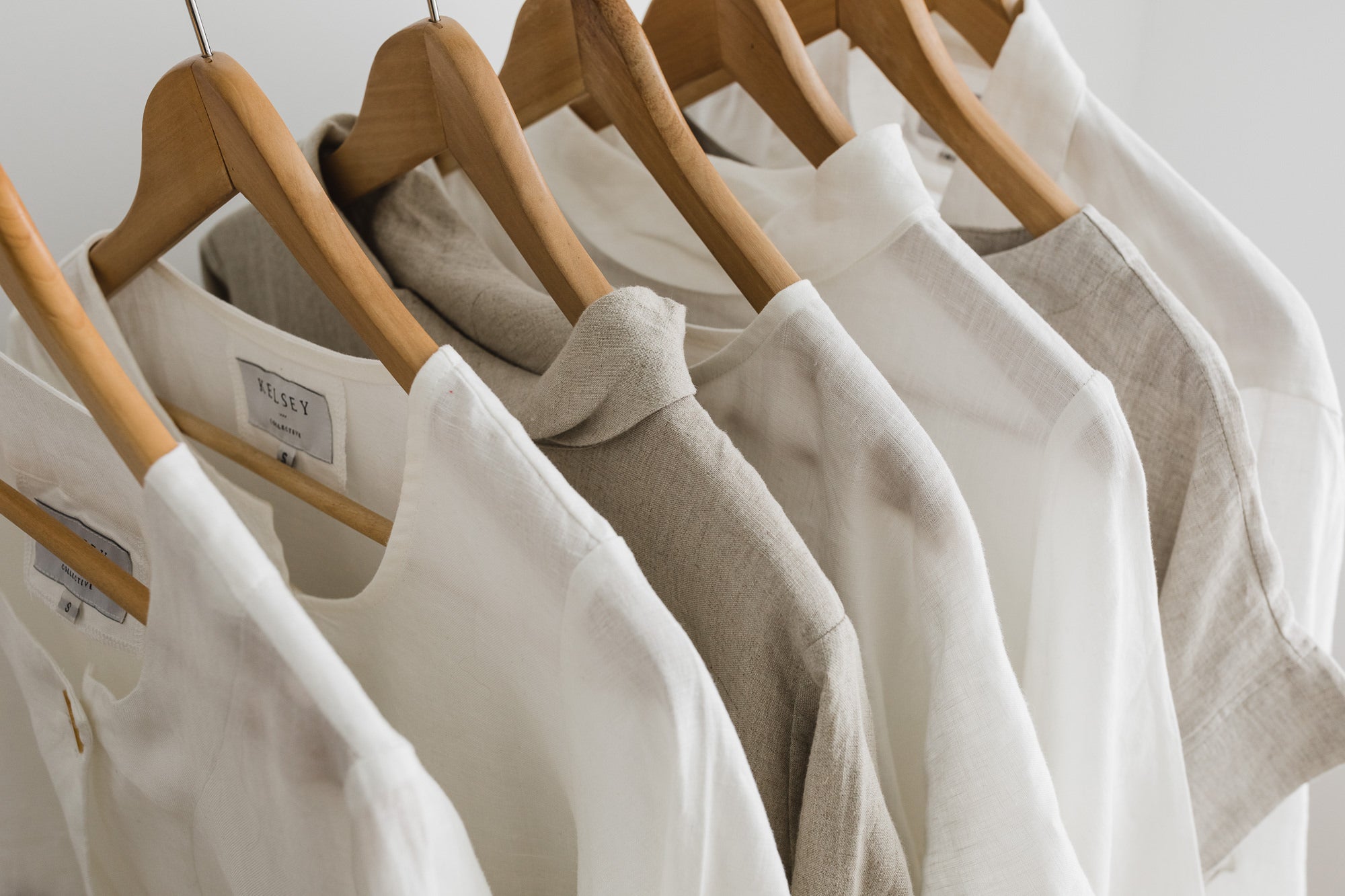 Linen shirts hanging on timber coat hangers