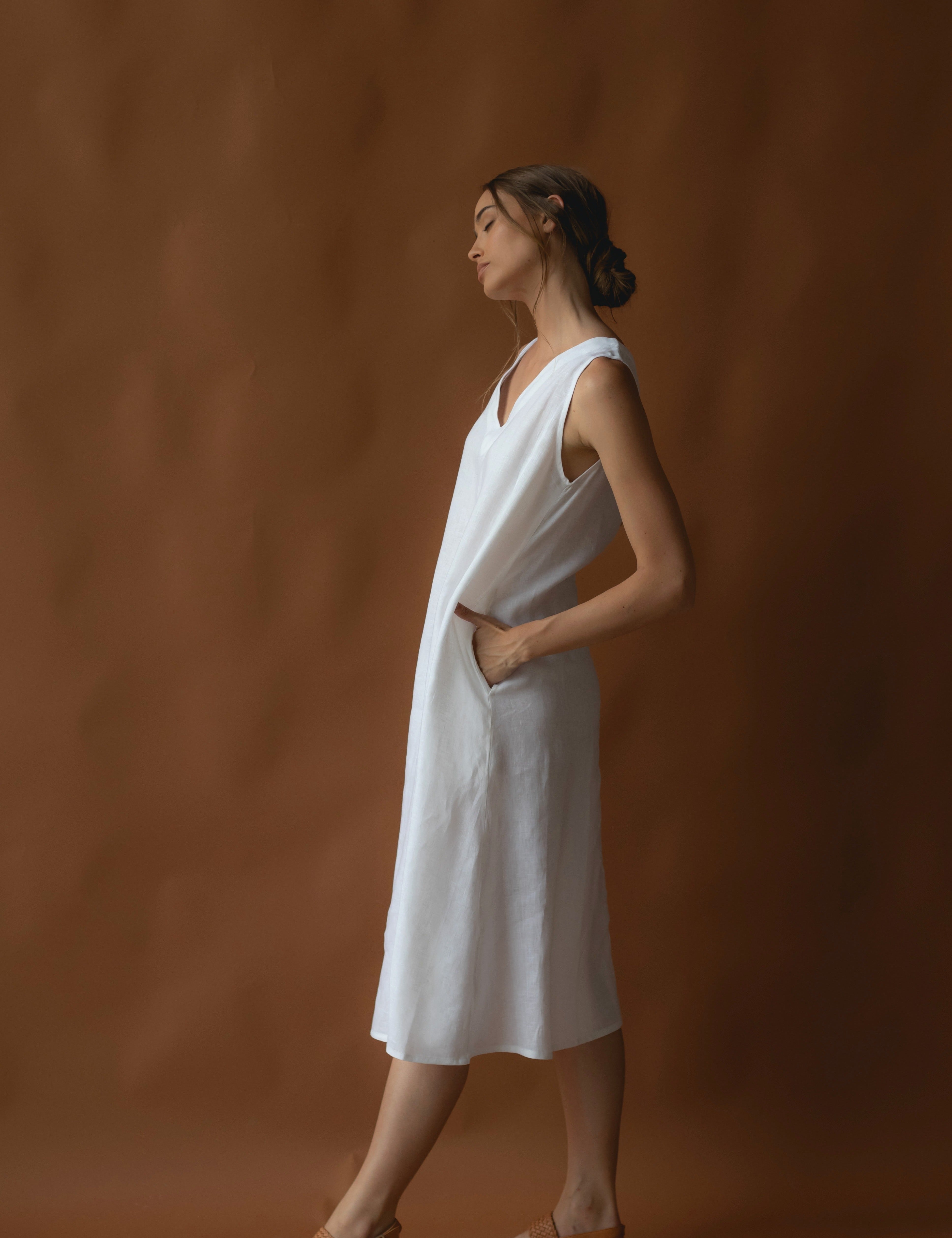 women wearing a long white linen dress on sale