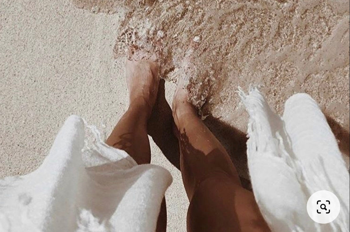Winter escape collection white linen clothing range feet in beach