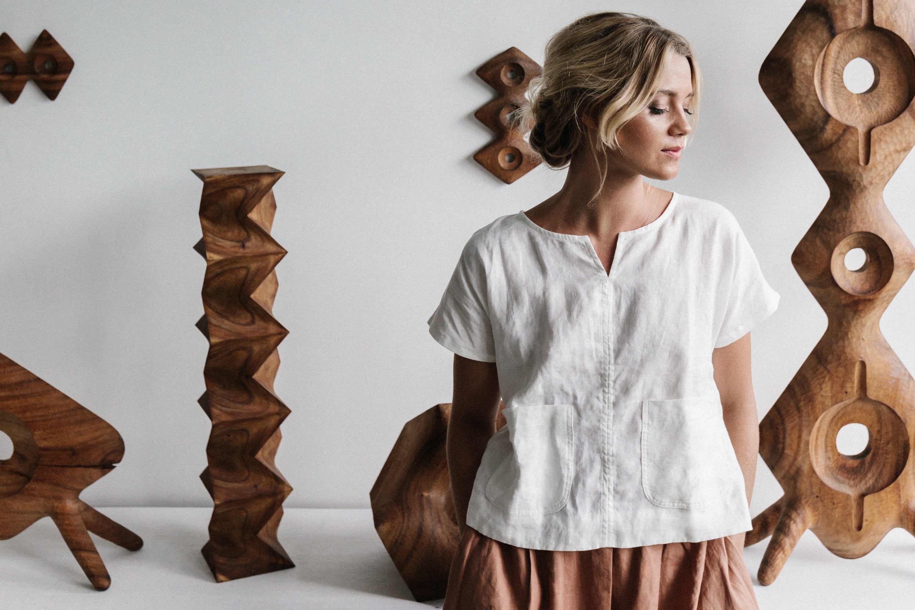 Women wearing white linen top called Zoe with neck detail and pockets