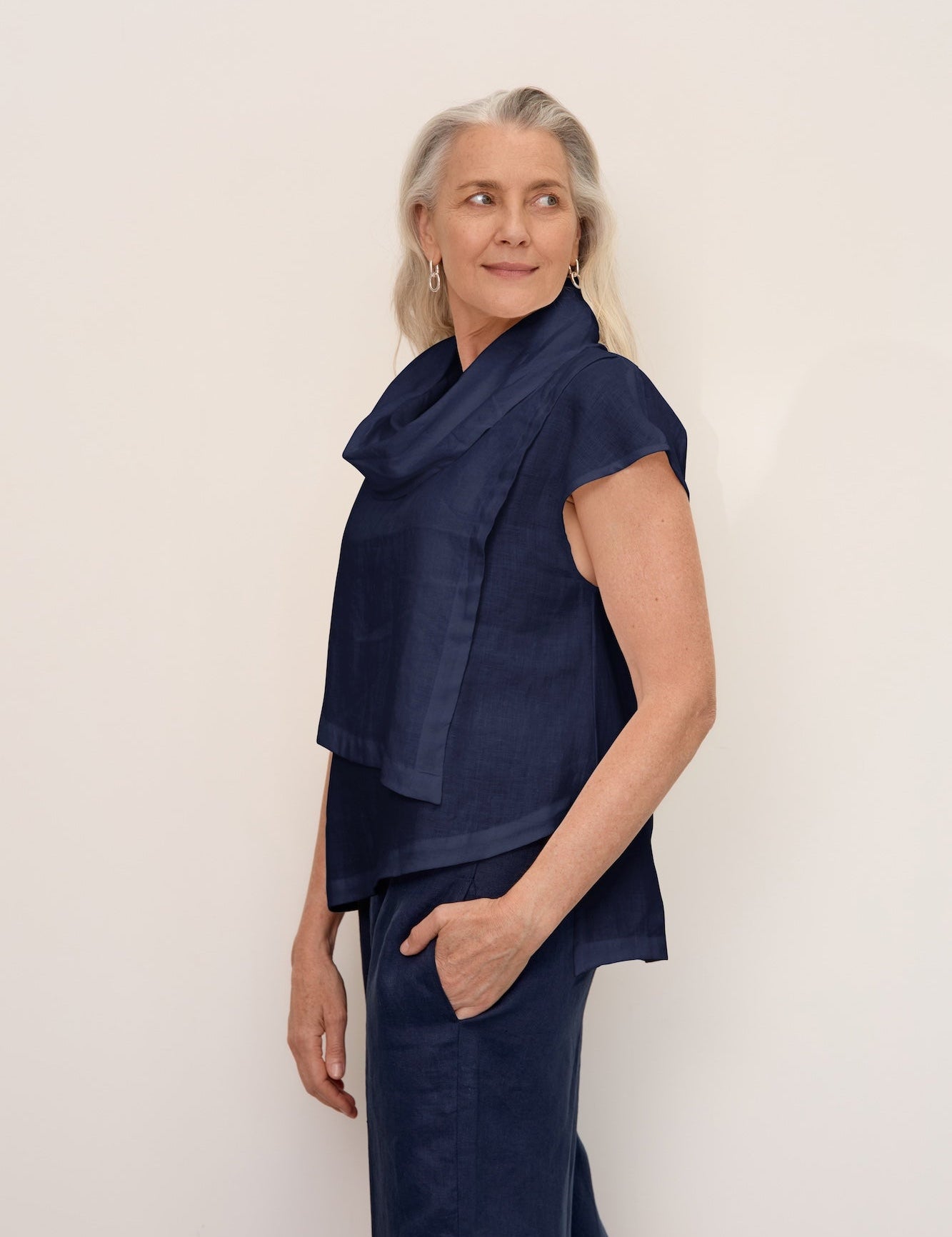 Women wearing new charcoal linen dress with sleeves and knitted cotton vest