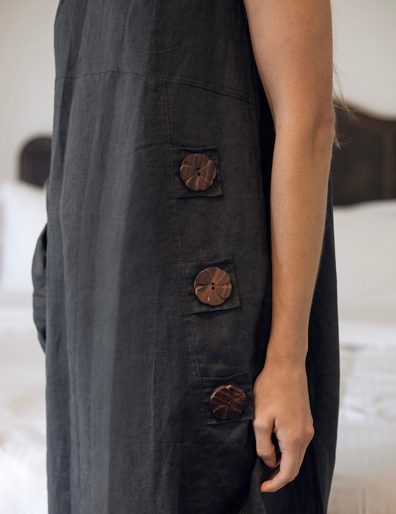 Daisy Linen Dress Charcoal showcasing statement buttons, perfect for a stylish and comfortable look.