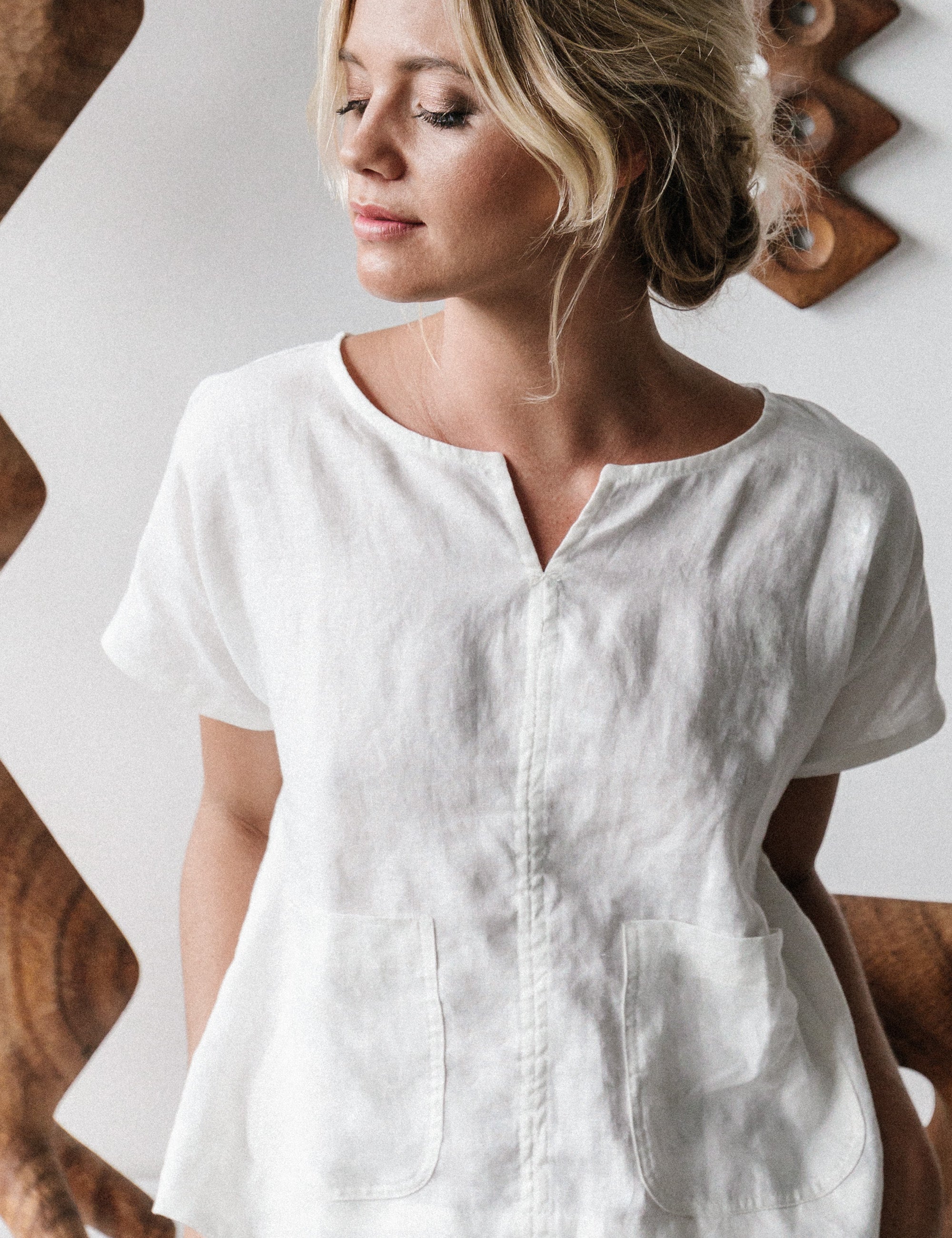Model wears Zoe Linen Top Warm White a considered slightly cropped design