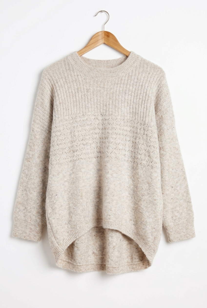 Marlo Wool Blend Jumper Soft Stone displayed on a hanger, showcasing its soft knit texture and relaxed style.