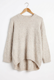 Marlo Wool Blend Jumper Soft Stone displayed on a hanger, showcasing its soft knit texture and relaxed style.