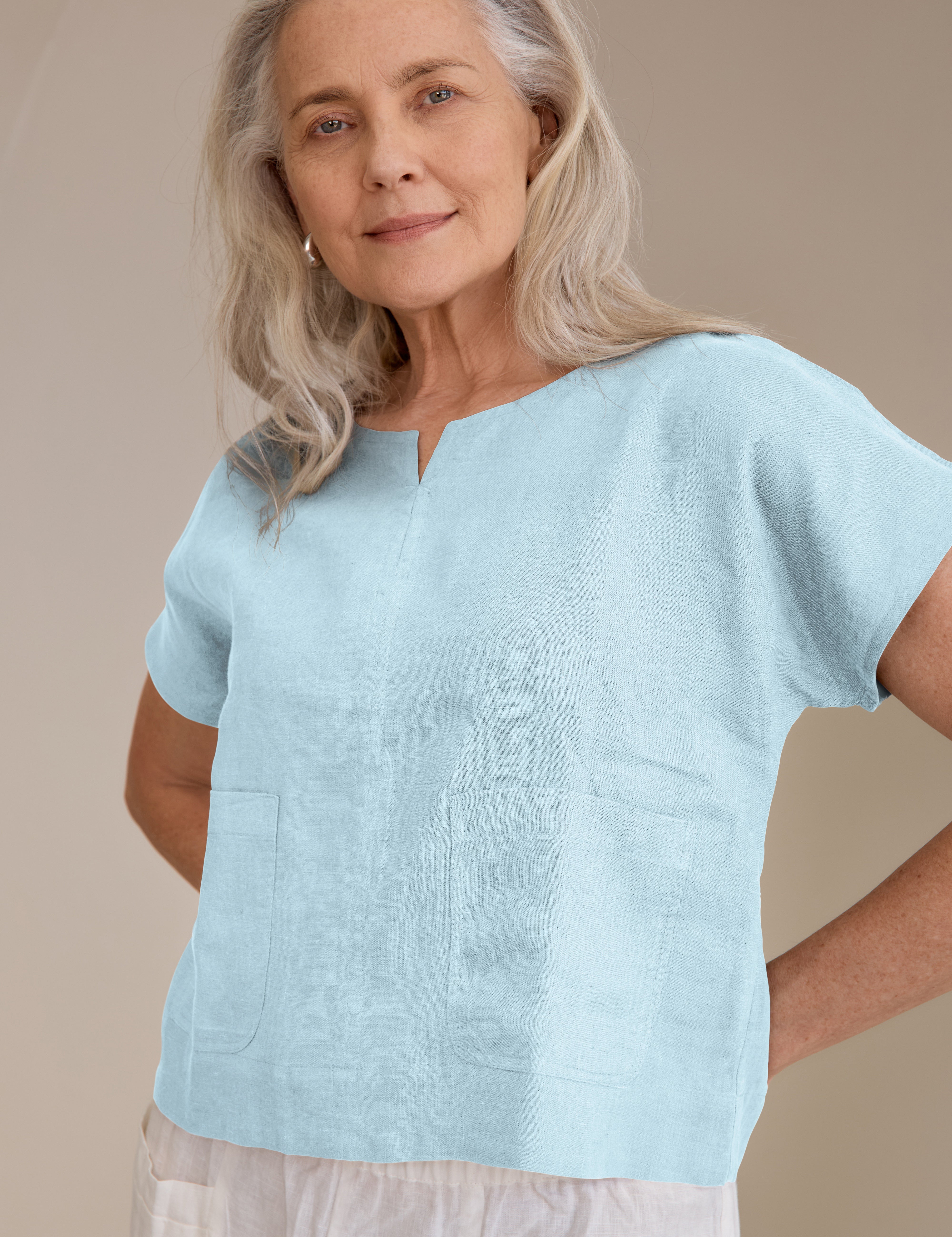 Model wears Zoe Linen Top Sea a considered slightly cropped design